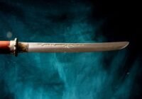 a sword on a blue surface