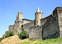 grey concrete castle under blue sky during daytime