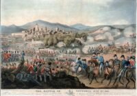 Historical Battle of Vittoria scene showing soldiers, cavalry, artillery, smoke, and a town surrounded by mountains during the 1813 battle.