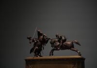 Bronze sculpture of two knights on horseback fighting