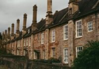 Row of old stone houses with tall chimneys
