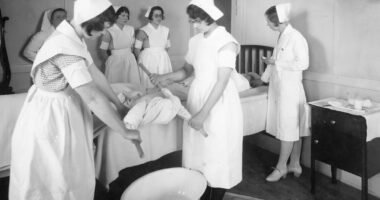 a black and white photo of a group of nurses