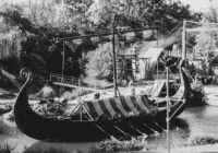 an old boat sitting in a body of water